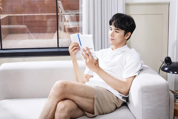 Summer Lifestyle Korean Asian Young Man Reading Couch — 스톡 사진