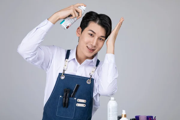 stock image millennials and gen z, korean asian young man grooming his hair