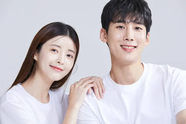 Korean Asian Young Couple Sitting Hands Shoulders Studio Background — Stock Photo, Image