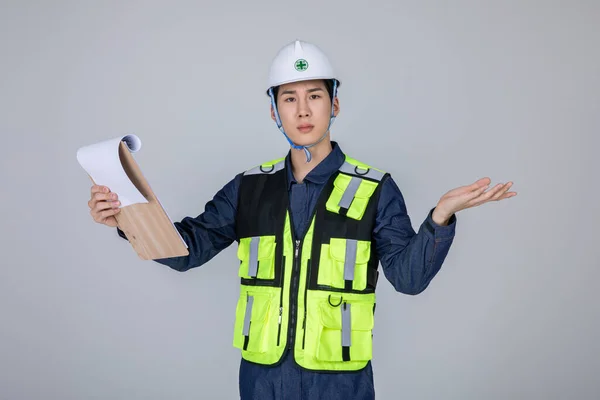 stock image millennials and gen z, korean asian young man, site staff checking a document, studio background