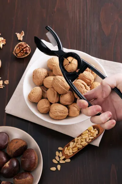 Various Nuts Peeling Walnuts Table Plate — Stock Photo, Image