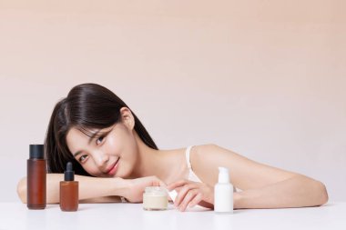 A Woman in Her 20s Posing With Cosmetics clipart