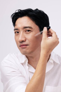 korean handsome middle age man making face treatment clipart