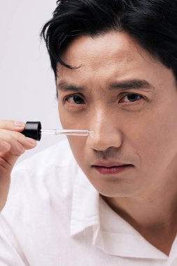 korean handsome middle age man making face treatment clipart