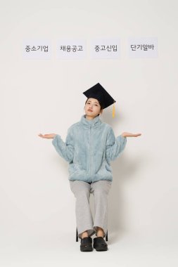 A student wearing a graduation cap and thinking clipart