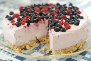 Slices of  yogurt cake with blueberries and raspberries clipart