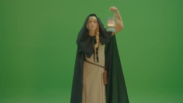 Green Screen Woman Sorceress Cloak Hood Medieval Dress Walks Lamp — Stock Video