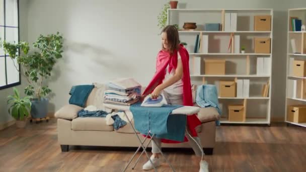 Happy Woman Housewife Super Hero Cape Dancing While Ironing Clothes — Αρχείο Βίντεο