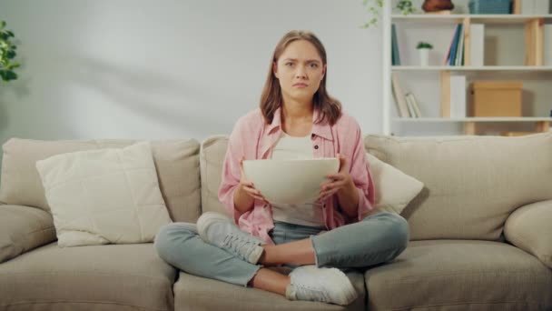 Young Woman Sitting Sofa Eating Popcorn Watching Scary Movie Scared — Stock Video