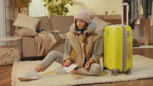 Disappointed Young Woman Hat Suitcase Sitting Carpet Sad Woman Traveler — Stock Video