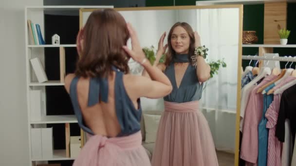 Back View Pretty Young Woman Corrects Her Appearance Front Mirror — Vídeo de stock
