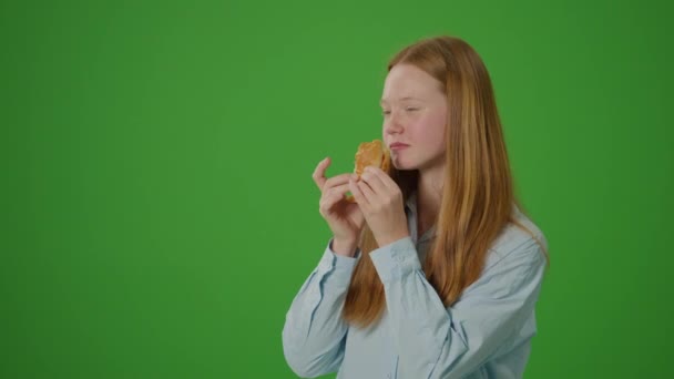 Green Screen Young Attractive Girl Enjoys Large Delicious Burger Contrast — Stock Video
