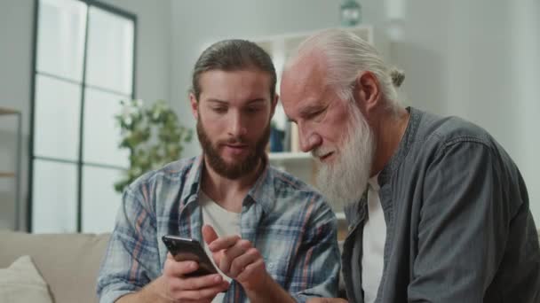 Son Introducing Dad Digital World Using Gadgets Elder Tech Education — Stock Video