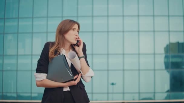 Happy Businesswoman Talking Cell Phone Holding Documents Her Hands While — Stock video
