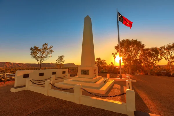 Flag of the Northern Territory at sunset in Anzac Hill War Memorial. The most visited landmark in Alice Springs, Northern Territory, Central Australia. The lookout for panoramic town at sunset.