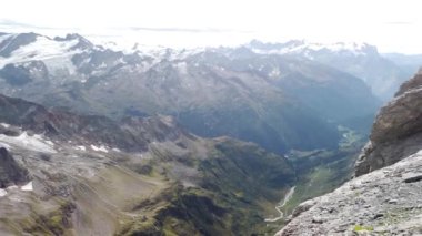 Uri Alps panorama on top of Titlis mount, between Obwalden and Bern. Switzerland. The highest suspension bridge in Europe, 3041 meters.