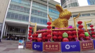 Kuala Lumpur, Malaysia - January 2023: Statues of cute golden rabbits of Chinese New Year 2023 in Chinese astrological calendar, which is the year of the rabbit. At Suria mall of Petronas towers.