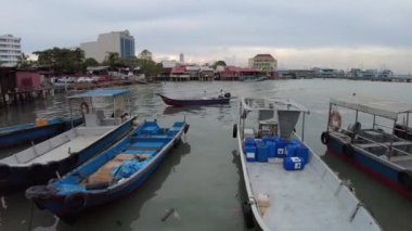 George Town, Malaysia - Jan 2023: Chew Jetty is ancient Chinese dwellings, wooden pathways, and eye-catching wall art. Its a symbol of the Chew Clans cultural legacy, with nearby eateries and stores