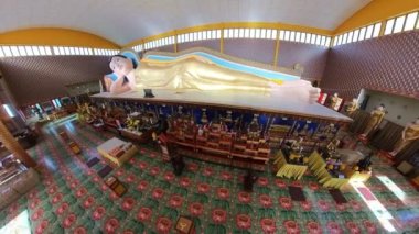 George Town, Malaysia - Jan 2023: reclining Buddha statue in Chaiya Mangalaram Thai Buddhist Temple, also known as the Wat Chaiya Mangalaram. Famous Thai temple founded in 1845 by Thai Buddhist monks.