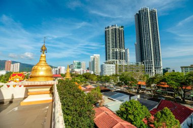 The Penang Burmese Buddhist Temple, also known as Dhammikarama Burmese Temple, can be seen in a panoramic view from the air in George Town in Malaysia. This temple was established in 1803.