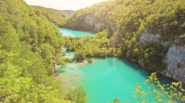 Milke Trnine Waterfalls with Milanovac and Gavanovac lakes viewpoint. Supljara Cave in the Plitvice Lakes National Park of Croatia in Lika. Sunshine on Kozjak and Milanovac lakes. UNESCO of Croatia