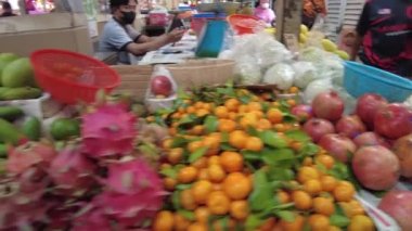 Kuala Lumpur, Malaysia - Jan 2023: in Chow Kit Market Vendors known for friendly and engaging personalities are often happy to share their knowledge of local produce and cooking tips with customers