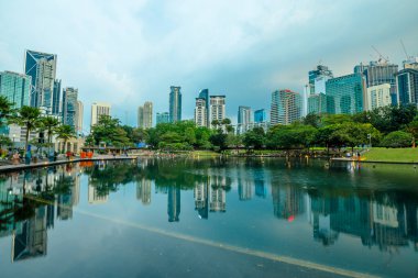 Kuala Lumpur, Malaysia - January 2023: Petronas Twin Towers plaza the most iconic spots in Kuala Lumpur, offering a stunning view of the citys skyline. breathtaking sight of the towering skyscrapers.