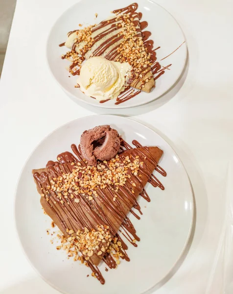 French crepes with chocolate are a delectable treat. Sweet crepes with cream. Theyre a traditional French sweet dessert and popular street food in France, making them a must-try when visiting Europe