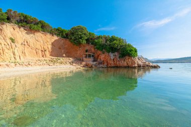 Swimming in the waters around the Ksamil Twin Islands are some of the clearest in Albania, and are perfect for swimming, sunbathing, and snorkeling. clipart