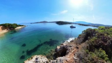Ksamil Twin Islands are two small islands located off the coast of Ksamil, Albania. Islands are connected by a narrow sandbar and are known for beautiful beaches, crystal-clear waters, lush vegetation