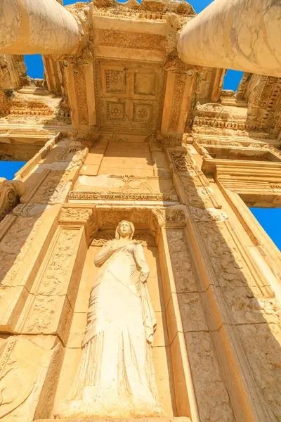 Library of Celsus and gate of Augustus in Ephesus archeological site in Turkey. Today the Library of Celsus continues to inspire awe, drawing travelers and history enthusiasts worldwide. vertical view