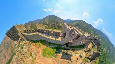 Panoramic aerial view of the medieval Maglic fortress, strategically positioned on a hilltop overlooking the meandering ibar river, showcasing its historical significance and stunning natural clipart