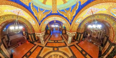 Topola, Serbia, Sept 2,2024: the St. George Church crypt in Serbia, where colorful frescoes cover the walls and ceiling, harmonizing with the luxurious marble flooring beneath clipart