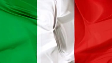 Rüzgarda dalgalanan İtalyan bayrağının kusursuz döngü arka planı, canlı yeşil, beyaz ve kırmızı dikey çizgilerini sergiliyor, İtalyanların ulusal kimliğini ve mirasını simgeliyor.