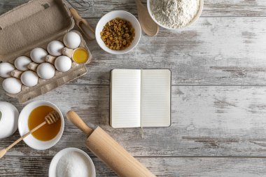 Notepad and baking products on the table. There is space for text.