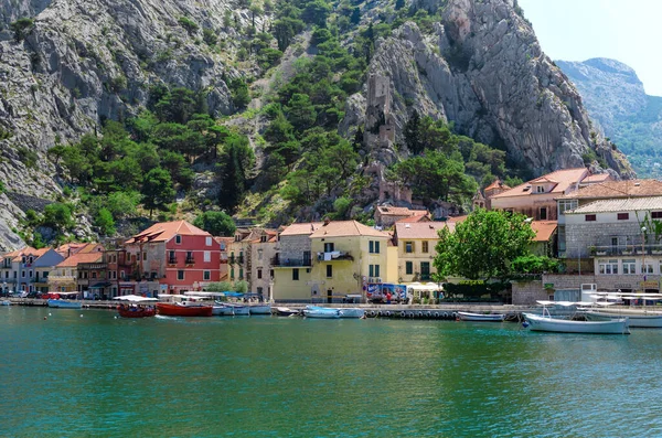 stock image OMIS, CROATIA - 7 JULY, 2017: Embankment with houses near the sea channel.