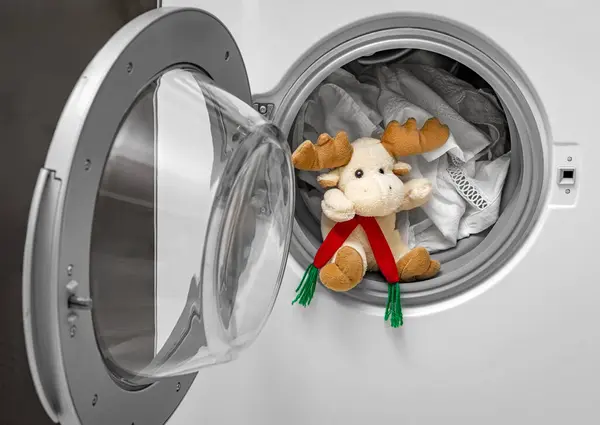 Washing soft toys in the washing machine along with laundry.