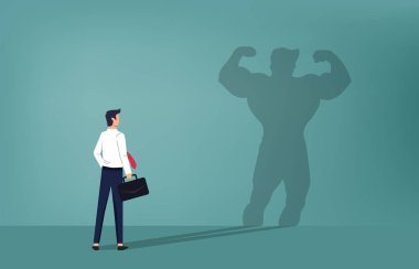 Cesur iş adamı gölgesine güçlü bir şekilde bakar. İş başarısı, kendine güvenen liderlik, hırs ya da güç kavramı. İş adamının kariyer artışı veya tanıtımı
