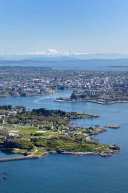 Aerial photo of Victoria BC with Esquimalt located in the foreground. Mt. Baker in Washington State is on the horizon, Victoria, Vancouver Island, British Columbi clipart