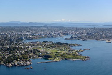 Aerial photo of Victoria BC with Esquimalt located in the foreground. Mt. Baker in Washington State is on the horizon, Victoria, Vancouver Island, British Columbi clipart