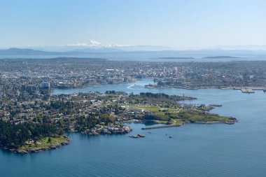 Aerial photo of Victoria BC with Esquimalt located in the foreground. Mt Baker in Washington State is on the horizon, Victoria, Vancouver Island, British Columbi clipart