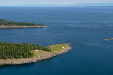 East Point Lighthouse aerial photo, Gulf Islands National Park, Saturna Island, British Columbia, Canada. clipart