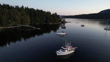 Boats at anchor, Russell Island, Gulf Islands National Park, British Columbia, Canada. clipart