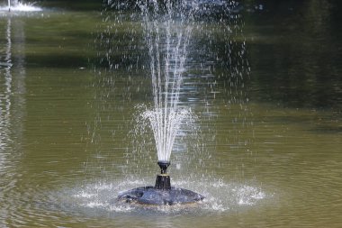 Cooling down around the fountains of Badenweiler in the Black Forest, Southern Germany on the border to Switzerland in Europe