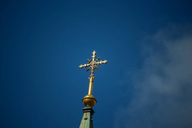 Distinct buildings and silhouettes shining against the golden sun in Badenweiler, Southern Germany, Europe near to the Black forest under the Easter sky in April