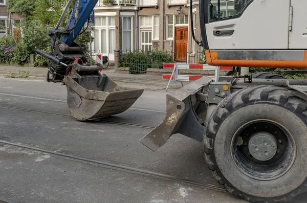 stock image Machine with Big Bucket for Road Works Close-up