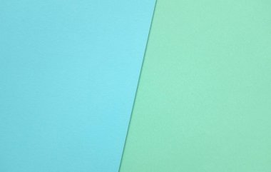 Arka plan için iki ton yeşil pastel ve mavi pastel kağıt rengi. Zeminde iki renkli kağıt vardı ve görüntünün yarısını böldü. arkaplan. Metin için yer alan üst görünüm