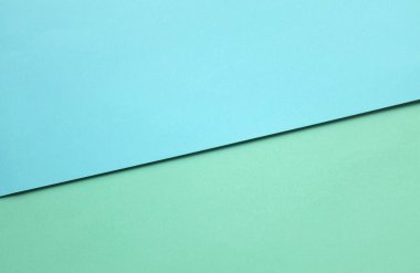 Arka plan için iki ton yeşil pastel ve mavi pastel kağıt rengi. Zeminde iki renkli kağıt vardı ve görüntünün yarısını böldü. arkaplan. Metin için yer alan üst görünüm