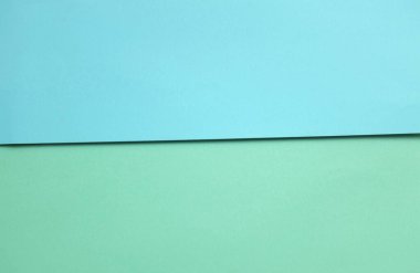 Arka plan için iki ton yeşil pastel ve mavi pastel kağıt rengi. Zeminde iki renkli kağıt vardı ve görüntünün yarısını böldü. arkaplan. Metin için yer alan üst görünüm