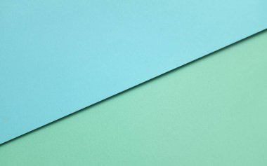 Arka plan için iki ton yeşil pastel ve mavi pastel kağıt rengi. Zeminde iki renkli kağıt vardı ve görüntünün yarısını böldü. arkaplan. Metin için yer alan üst görünüm